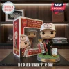 Mikel Arteta vinyl figure wearing Arsenal 2026 Champions cap, holding Premier League trophy on a grass-textured base.!