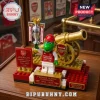 Arsenal FC brick construction set featuring a green dinosaur mascot holding a silver Premier League trophy and gold cannon.!