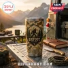 Camo pattern Yeti tumbler with Bigfoot graphic, mountain silhouette, and text Bigfoot Est. 1967 on a metal camping table.!