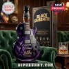 Black Sabbath Paranoid themed guitar-shaped glass whiskey bottle with purple finish, standing on a green tufted sofa.!