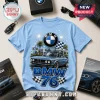 Light blue crew neck t-shirt featuring a vintage BMW car illustration, BMW logo, fireworks, and text BMW 76.!