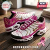 Custom breast cancer awareness sneakers featuring white, pink, and gold colorways with ribbon motifs on wood flooring.!