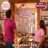 Breast cancer awareness wind chime with pink ribbons, metallic tubes, and decorative hanging charms against a home interior.!