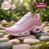 Pink breast cancer awareness sneaker with white laces, silver accents, and faith-hope-love text on a rock path background.!