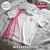 White polo shirt with pink breast cancer ribbon, heart icon, and customizable name space on a grey textured background.!