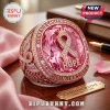 Rose gold ring featuring a large pink crystal, a diamond-encrusted ribbon, and the text Breast Cancer Awareness and Hope.!