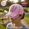 Pink baseball cap featuring a glittery breast cancer awareness ribbon with wings, rhinestones, and text Breast Cancer Survivor.!