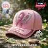 Pink baseball cap featuring a glittery breast cancer awareness ribbon with wings, rhinestone trim, and embroidered text.!