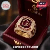 Brisbane Broncos We Charge On gold championship ring with team logo, ruby red stone, and pavé crystals in velvet case.