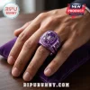 BTS Apobangpo World Tour 2026 Purple Championship Ring with a central purple stone and engraved metal wing logo on finger.