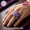BTS Apobangpo World Tour 2026 purple championship ring worn on a finger featuring a central gemstone and metallic crown.