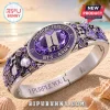 BTS Borahae Purple Crystal Stainless Steel Bracelet featuring music notes, ARMY logo, and inscribed text on a sandy beach.