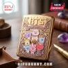BTS BT21 Limited Edition Gold Metal Lighter Case featuring embossed Cosmic Friends characters and intricate floral details.