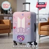 BTS BT21 Pastel Pink Luggage Cover with vertical stripes, central BTS logo, and colorful BT21 character stickers.