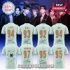 Eight light green sports jerseys featuring BTS member names, birth years, and printed member signatures on the back.!