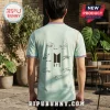 Back view of a person wearing a light green jersey featuring the BTS logo and multiple black signatures.!