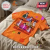 BTS Permission To Dance Orange T-Shirt featuring printed photos of band members, bold text graphics, and flower icons.