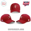 Red baseball cap featuring white T-Mobile logo, surrounding signatures, FC Bayern Munich badge, and BTS logo on white background.!