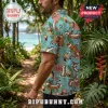 Man wearing a light blue tropical Hawaiian shirt featuring a repeating Calvin and Hobbes pattern with pink hibiscus flowers.!