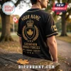 Black baseball jersey with gold Canadian Armed Forces crest, crown, maple leaf, and text on back. Park setting background.!