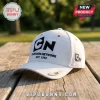 Cartoon Network EST 1992 White Baseball Cap with black logo embroidery, metal side accents, on a wooden outdoor surface.