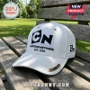 Cartoon Network EST 1992 White Baseball Cap with black logo embroidery, gold accents, and metal side badge on park bench.