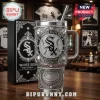 Chicago White Sox stainless steel tumbler with intricate silver engraving, baseball motifs, and stadium detail on a desk.!