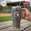 Cleveland Guardians metal tumbler with engraved baseball stadium design, team logo, and integrated straw on wooden table.!