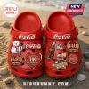 Coca-Cola 140th Anniversary With Charms Clogs featuring red foam material decorated with beverage and polar bear motifs.