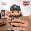 New York Yankees baseball player vinyl figure with beard wearing a navy cap and grey jersey holding a 2026 MVP bat.!