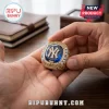 Gold Yankees championship ring with blue stone, text reading Cody Bellinger and All-Star Game MVP held in a hand.!