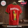 Red Portugal soccer jersey featuring a World Cup trophy graphic with the Portuguese flag and green collar and sleeve trim.!