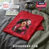 Red cotton t-shirt featuring a Cristiano Ronaldo graphic with a gold trophy and a signature on a gray fabric background.!