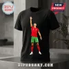 Black cotton t-shirt featuring a digital graphic of Cristiano Ronaldo in a Portugal red jersey with number 7 reaching up.!