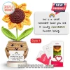 Crocheted sunflower in a tan yarn pot holding a sign that reads this is a little reminder that you are a marvelous human.!