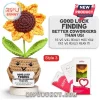 Crocheted sunflower in tan pot holding a sign that reads Good luck finding better coworkers than us on a wooden base.!