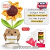 Crochet sunflower in a brown pot with a positive message sign, seated on a wooden base next to retail gift packaging.!