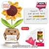 Crocheted sunflower in a tan pot with eyes and a sign reading Thank you for being such an important part of my story.!