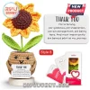 Crocheted sunflower in a smiling brown yarn pot holding a thank you note on a round wooden base next to gift packaging.!