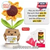 Crocheted sunflower in a tan yarn pot holding a sign with inspirational text on a white wooden base.!