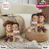 Custom Liam Woody Cowboy Shaped Plush Pillow showing a plush cowboy doll hugging a baby doll with the name Liam on it.