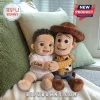 Custom Liam Woody Cowboy Shaped Plush Pillow showing a toddler doll named Liam hugging a Woody plush on a soft cushion.