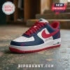 Custom Nike Air Force 1 sneaker featuring navy blue and white leather panels, red laces, swoosh, and Atlanta Braves logo.!