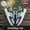 Custom Minnesota Timberwolves Nike Air Force 1 sneakers with navy blue, white, and lime green accents on a wooden bench.!