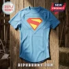 DC Comics Superman Blue Compression T-Shirt with iconic red and yellow chest logo on a rustic wooden background.