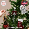 Depeche Mode 2026 Musical Advent Calendar items featuring a guitar player figure, crucifix ornament, and snow globe.