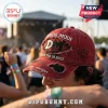 Depeche Mode Enjoy The Silence red distressed baseball cap with embroidered DM logo and black rose detail on side.
