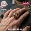 Depeche Mode Enjoy The Silence Red Stone Gold Ring featuring a deep red cabochon center and intricate band engravings.
