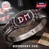 Depeche Mode Enjoy the Silence stainless steel bracelet featuring a red rose, piano keys, and DM logo on dark metal.
