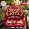 Red baseball cap with gold embroidered text In Loving Memory Diogo Jota 1996-2025 and number 20 on a park bench.!